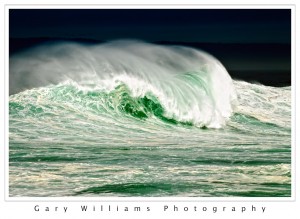Photograph of an enormous wave crashing near Pacific Grove, California