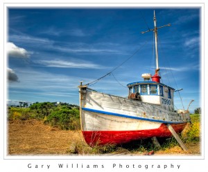 Photograph of a boat on dry land at Moss Landing, California