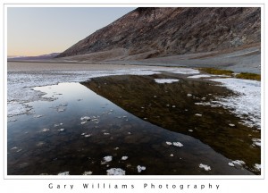 Photograph of a mountain reflected in a pool at Badwater, Death Valley National Park